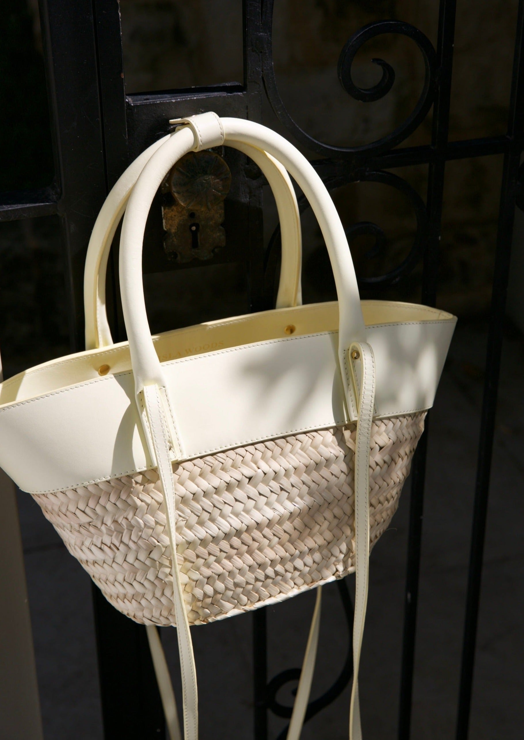 Isla Woods Hand made Basket bag hanging on french door 